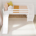 White wooden children's loft bed with slide and storage stairs, peach and mustard bedding and cloud pillow in a modern Scandinavian nursery with shiplap wall