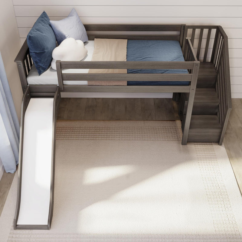 Top-down view of a grey wooden kids loft bed with slide and stairs, blue and beige bedding, cloud-shaped pillow and cozy rug in a modern children's bedroom