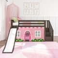 Dark wood girls loft bed with slide and pink playhouse tent, sheer pink canopy, pastel pillows and floral framed art in modern kids bedroom