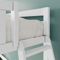 Close-up of white wooden bunk bed ladder and safety guardrail with beige bedding against teal wall in a modern kids' bedroom