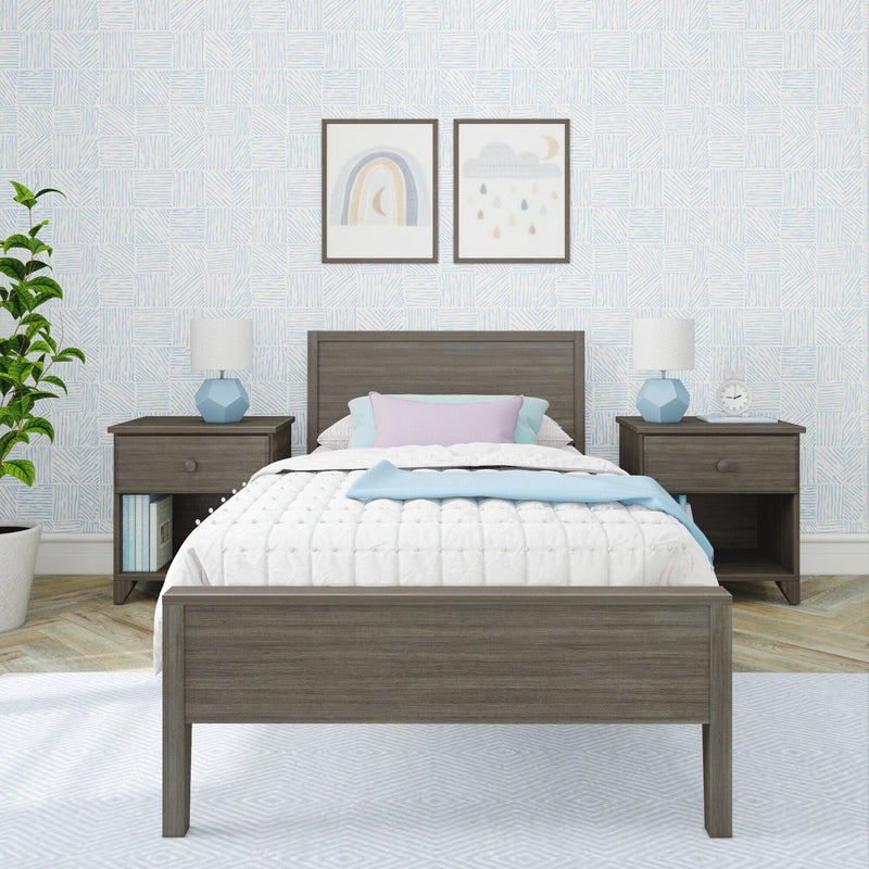 Kids bedroom with gray wood bed and nightstands, white quilted bedding, pastel pillows, blue geometric wallpaper and framed rainbow and cloud wall art