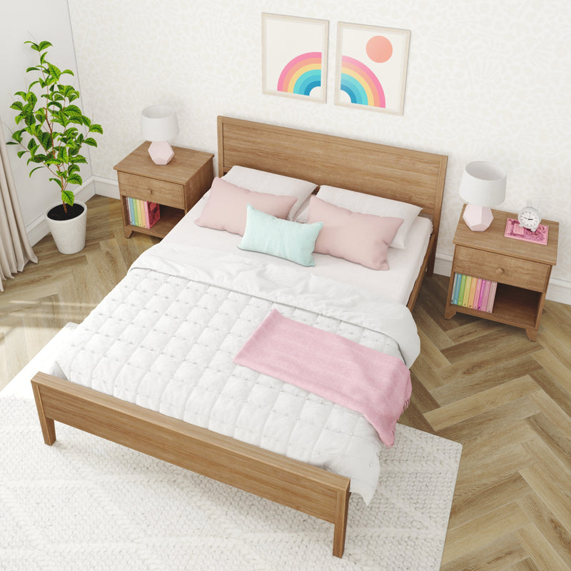 Scandinavian bedroom interior with wooden bed frame, pastel pink and mint bedding, matching wood nightstands with lamps, potted plant and colorful rainbow wall art
