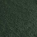 Close-up of dark green textured upholstery fabric, plush chenille boucle weave for sofas, cushions, and home decor