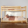 Solid wood loft bunk bed with ladder and pink gingham bedding in a modern kids' bedroom, cozy pillows and wooden floor