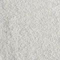 Close-up of white plush carpet texture with dense loop-pile fibers, soft living room rug surface