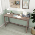 Minimal light wood writing desk in a mint green small home office with white lamp, succulent, notebook and patterned desk organizer, Scandinavian style