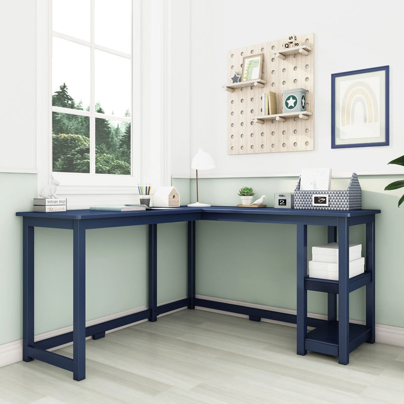 Navy blue L-shaped corner desk for home office — modern wooden workspace with pegboard shelves, storage baskets, lamp and window view