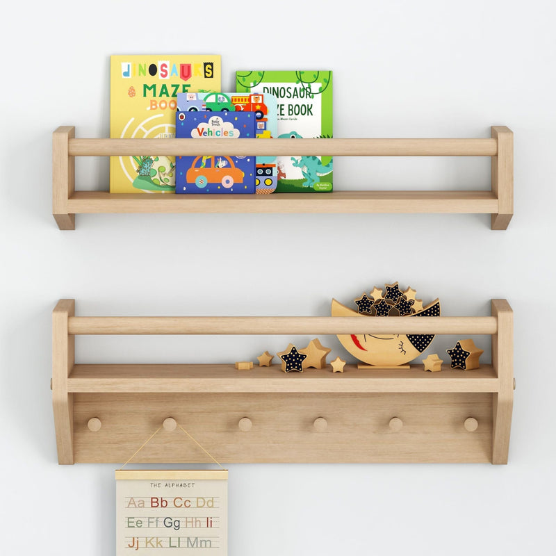 Wooden nursery wall shelf with colorful children's board books (dinosaurs maze, vehicles) and wooden moon-and-star toys on a light gray wall