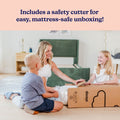 Mother and two children unboxing a boxed mattress using a safety cutter for easy, mattress-safe setup next to a green bed frame