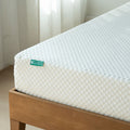 8-inch gel memory foam mattress with white diamond-quilted cover on wooden bed frame
