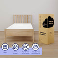 5-inch twin memory foam mattress in a box next to a light wood twin bed frame, showing unbox, unroll and 24-hour expansion instructions