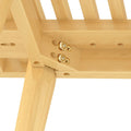 Close-up of a wooden table joint with visible screws, showcasing sturdy construction and craftsmanship.