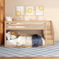 Modern wooden bunk bed with built-in stairs in a neutral kids' room, cozy white and orange pillows, sun-themed framed wall art, and blue plaid rug