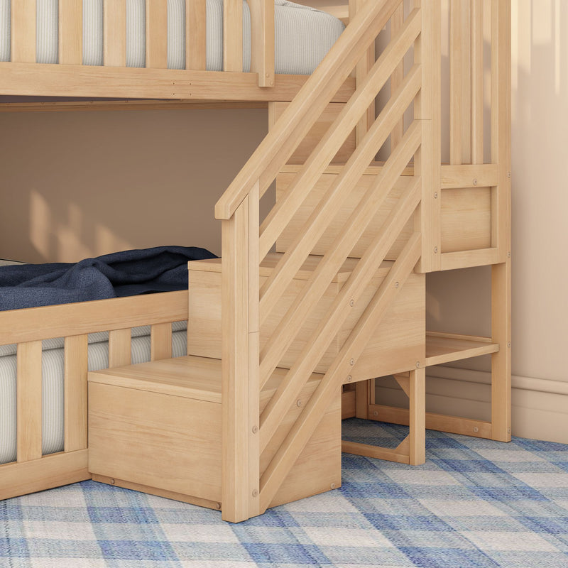 Light natural wood bunk bed with built-in staircase storage, gray striped mattress, navy blanket and blue plaid rug — modern kids bedroom furniture