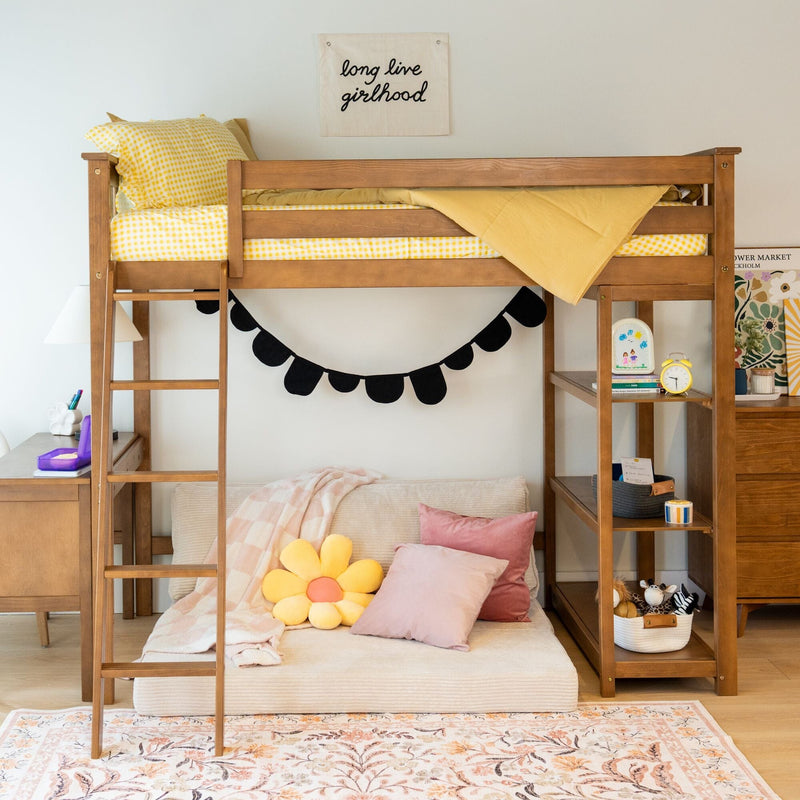 Wooden kids loft bed with ladder, yellow gingham bedding and flower pillow, shelves and girls bedroom decor with "long live girlhood" wall sign