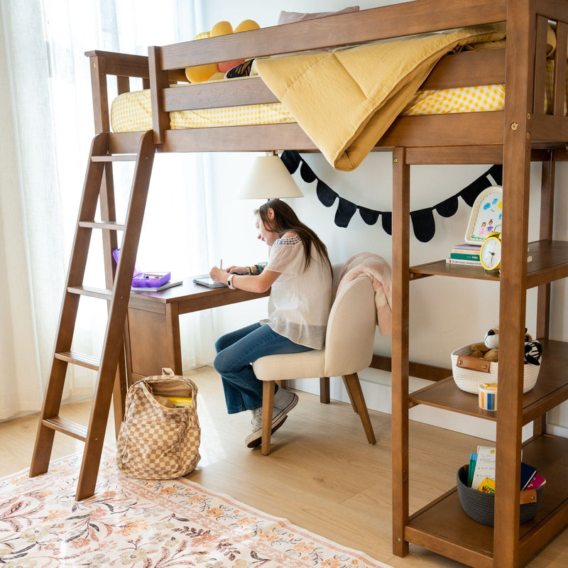 Child studying at a wooden loft bed with built-in desk and shelving, yellow gingham bedding and cozy kids study nook with natural light and organized storage