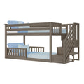 Gray wood bunk bed with built-in staircase and under-stair storage, light blue bedding — space-saving kids twin loft and bunk bed design