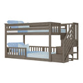 Twin-over-full wooden bunk bed with built-in staircase and guardrails in gray-brown finish with blue bedding