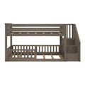 Gray-brown wooden L-shaped bunk bed with built-in staircase, slatted mattress supports and safety guardrails for kids' bedroom