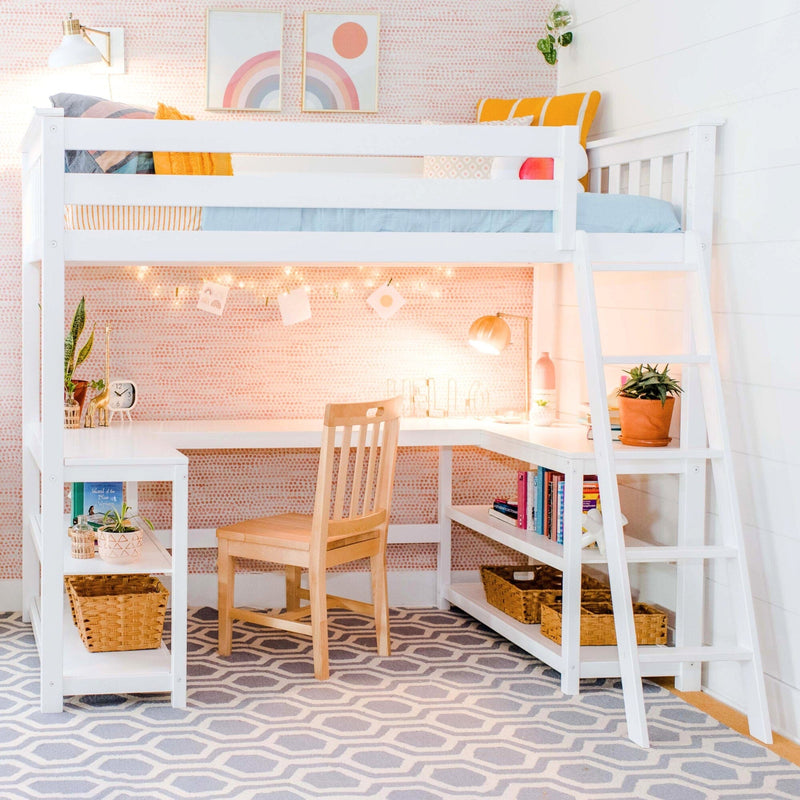 White loft bed with built-in desk and ladder, pastel rainbow wall art, string lights, wooden chair, potted plants and woven baskets in a bright modern kids' bedroom