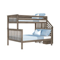 Gray oak twin-over-full wooden bunk bed with staircase and blue bedding