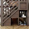 Modern wooden bunk bed with diagonal slat railing and built-in storage cubbies holding stacked books, white geometric decor and navy sneakers on hardwood floor