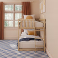 Wooden bunk bed in cozy neutral kids bedroom with large grid window, rust-orange curtains, mustard round pillow and blue plaid carpet