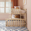 Cozy kids bedroom with natural wooden bunk bed, pastel pink walls, large sunlit window with sheer curtains, round accent pillows and plaid rug, modern kids room decor