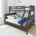 Grey oak twin-over-full wooden bunk bed with ladder, blue bedding, pillows and brass wall sconces in bright kids' bedroom