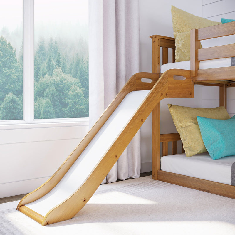 Modern wooden bunk bed with slide in kids' bedroom, yellow and teal cushions, white curtains and large window overlooking misty pine forest