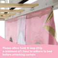 Pink princess bunk bed curtain with gold trim and mesh window attached by hook-and-loop strip to white loft bed frame — kids privacy curtain for girls' bedroom