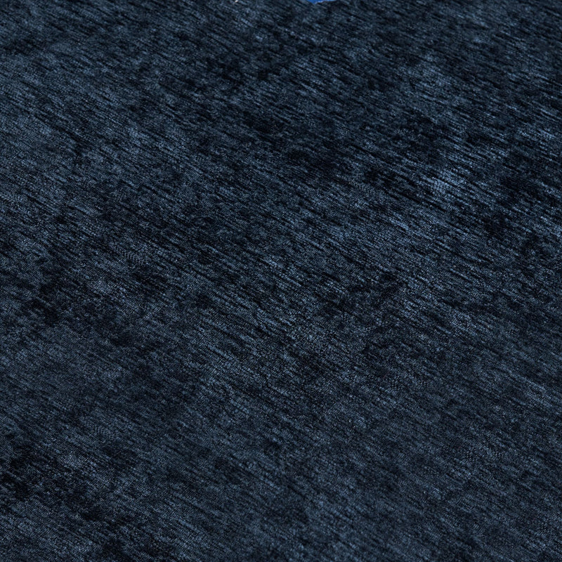 Close-up navy blue plush velvet fabric texture for luxury upholstery, rug and interior design background