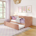 Cozy pink girl's bedroom with blush pull-out daybed, lavender bedding, butterfly cushion, floral framed prints, sheer pink curtains and rattan pendant lamp by a sunny window