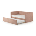 Blush pink upholstered daybed with pull-out trundle mattress, modern fabric single bed for kids or guest rooms