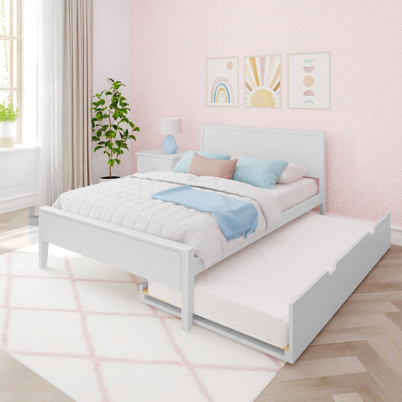 Kids' pastel bedroom with white trundle bed, pink scalloped wallpaper, rainbow and sun wall art, blue bedside lamp, pastel pillows and potted plant