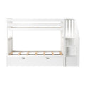 White wooden twin-over-twin bunk bed with side staircase, built-in under-bed drawer and slatted mattress supports