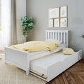 White kids' trundle bed with yellow polka-dot duvet, pull-out storage mattress, botanical wall art and indoor plant in a neutral modern nursery
