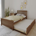 Modern minimalist bedroom with wooden trundle bed, yellow bedding, bedside table with lamp, potted plant and fruit wall art