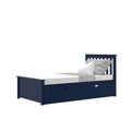 Navy blue wooden twin bed with under-bed storage drawer, white mattress and gray textured throw and pillow, modern children's bedroom furniture