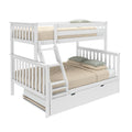 White wooden bunk bed with ladder and pull-out trundle drawer, beige bedding and green pillows - space-saving kids' bedroom furniture