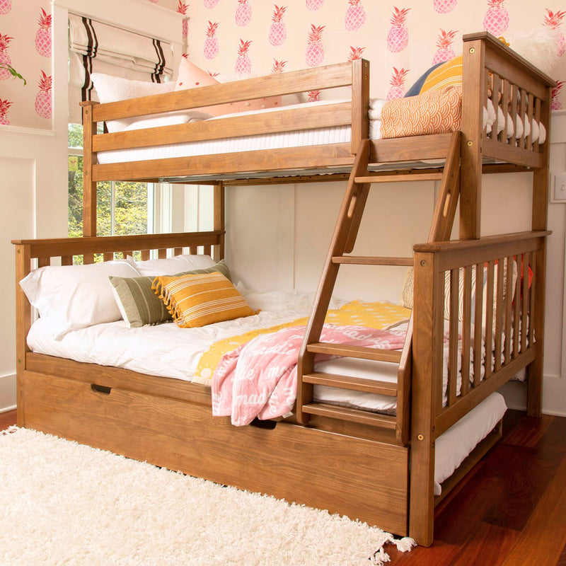 Solid wood bunk bed with ladder and trundle drawer in a children's bedroom with pink pineapple wallpaper and colorful throw pillows