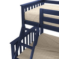 Close-up of navy blue wooden bunk bed ladder and guardrail with beige textured mattress cover