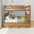 Wooden bunk bed with ladder and under-bed storage drawer, gray knit bedding and yellow accent pillows, brass wall sconces in modern kids bedroom