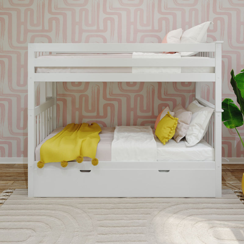 White wooden bunk bed in a modern kids' bedroom with pink geometric wallpaper, yellow throw blanket and pom‑pom pillow, white linens and green plant