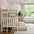 Bright kids' bedroom with white wooden bunk bed, pink geometric wallpaper, pastel cushions, yellow throw, indoor plant and window seat