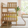 Natural wood bunk bed with yellow bedding in a bright children's bedroom with pastel pink walls, sheer curtains and potted plant