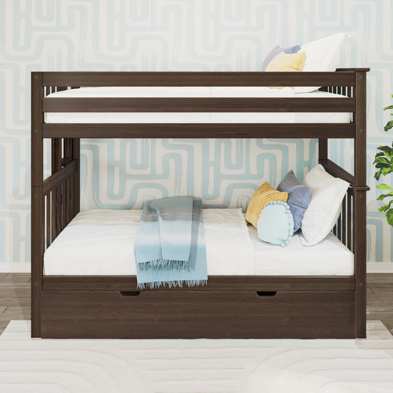 Dark wood twin-over-twin bunk bed with under-bed storage drawer, white bedding, light blue throw and decorative yellow and striped pillows in a modern children's bedroom with geometric wallpaper
