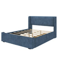 Blue upholstered platform bed frame with padded headboard, wooden slats and low-profile footboard, no mattress