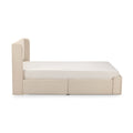 Beige upholstered platform bed with tall padded headboard and white mattress — modern minimalist bedroom furniture