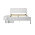 White wooden platform bed with panel headboard, wooden slatted mattress support, center support leg and under-bed pull-out storage drawers on casters